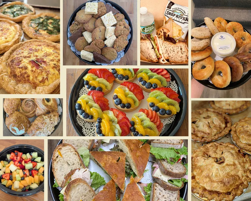 Catering spread from Blue Loon Bakery: quiches, fruit tarts, sandwich platters, bagels with cream cheese, cookies and pies