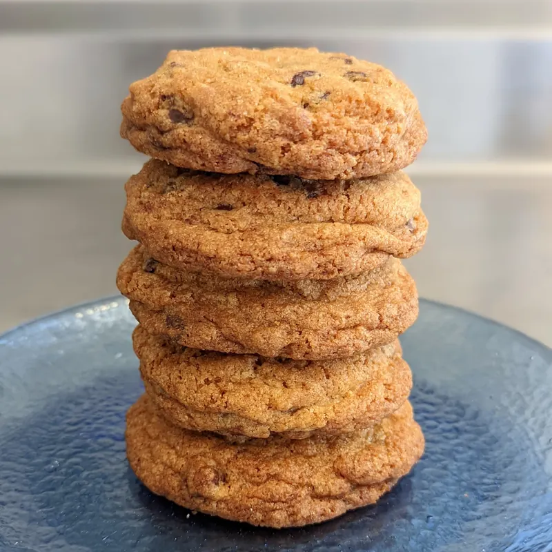 A tall stack of chocolate chip cookies
