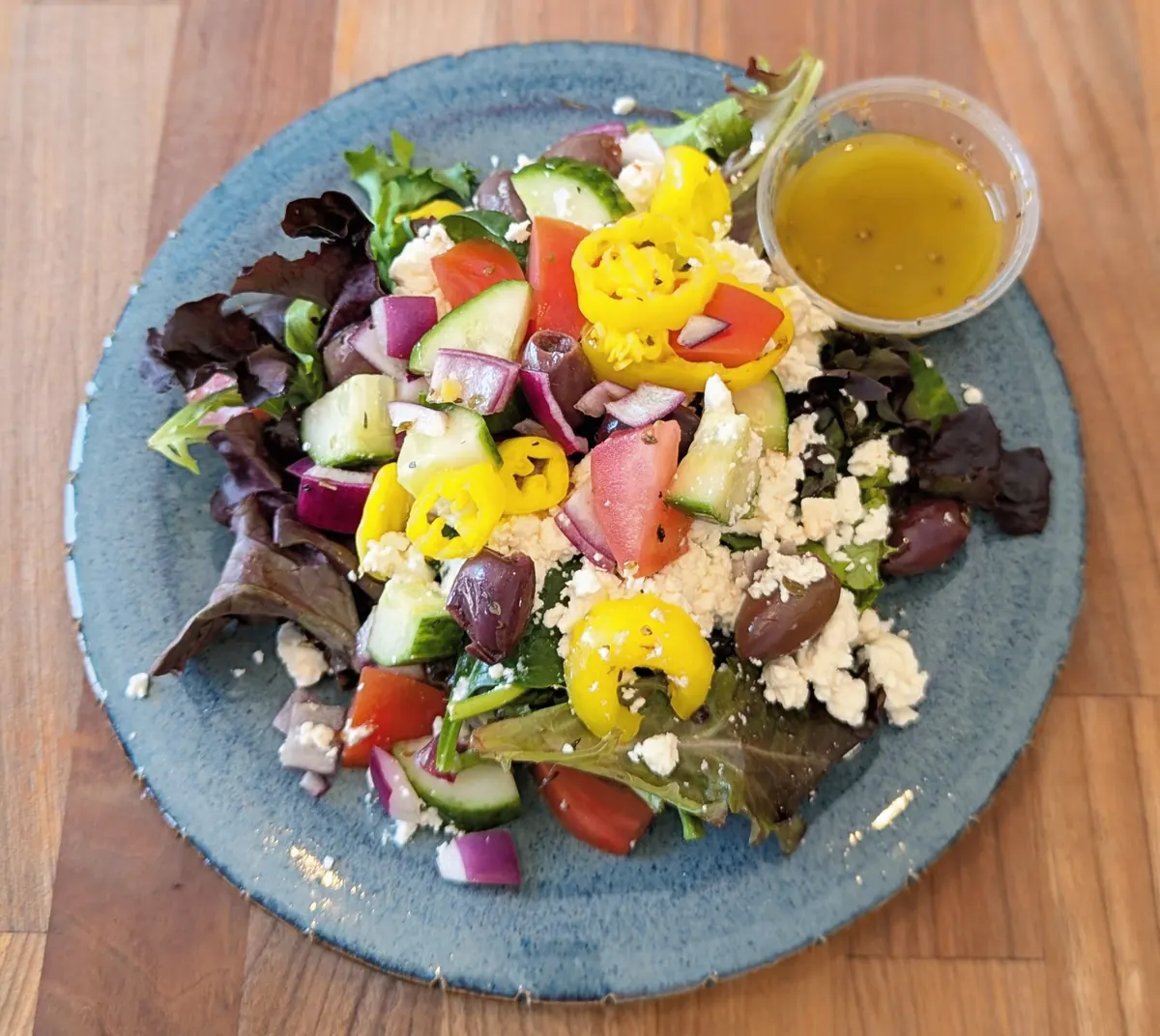 Salad with feta, olives, tomatoes, cucumbers and banana peppers