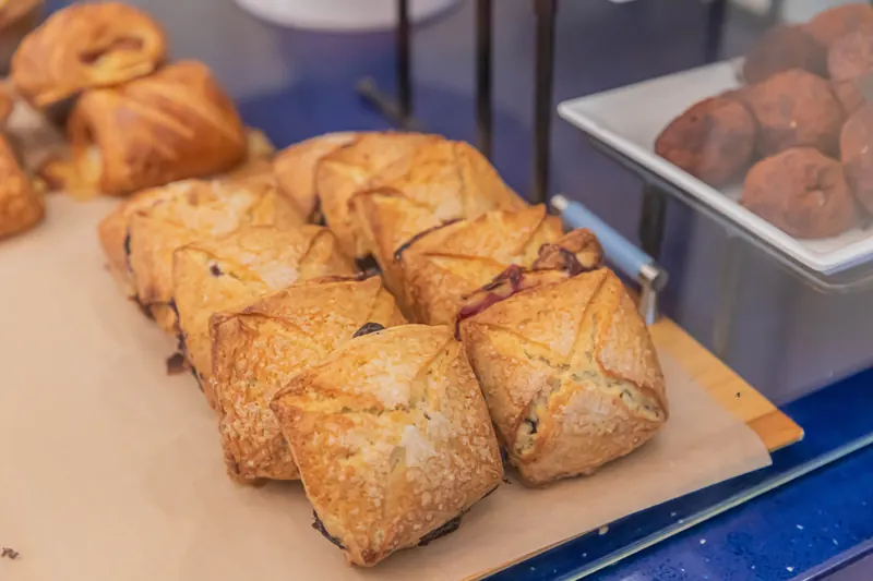 Turnovers and croissants in the bakery case